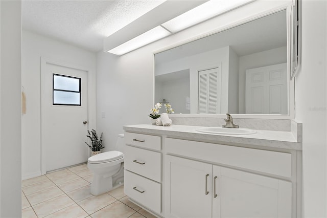 11411 Terrell, Spring Hill, FL 34606 - bathroom featuring vanity, toilet, and tile patterned flooring