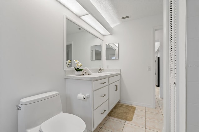 11411 Terrell, Spring Hill, FL 34606 - bathroom featuring vanity, toilet, and tile patterned flooring