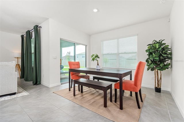 33668 Elm Hill Br, Wesley Chapel, FL 33545 - dining space with baseboards, light tile patterned flooring, and recessed lighting