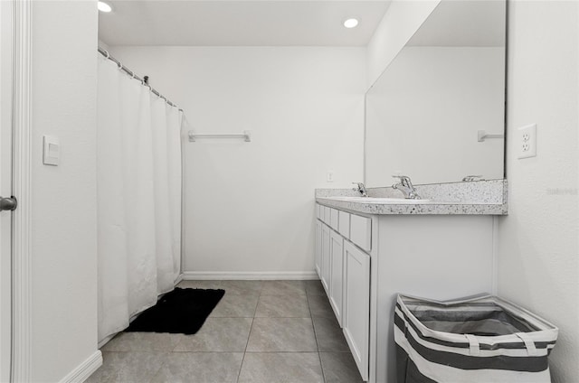 33668 Elm Hill Br, Wesley Chapel, FL 33545 - full bathroom with vanity, tile patterned flooring, and baseboards