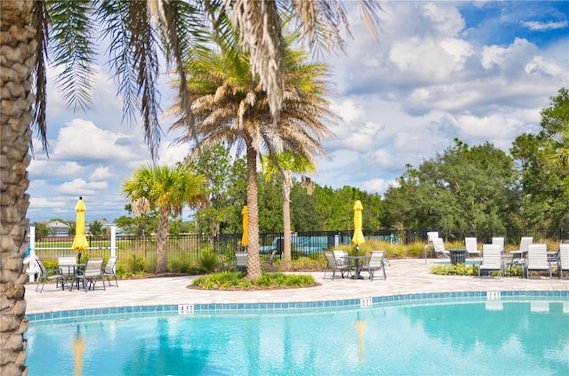 33668 Elm Hill Br, Wesley Chapel, FL 33545 - community pool featuring a patio area