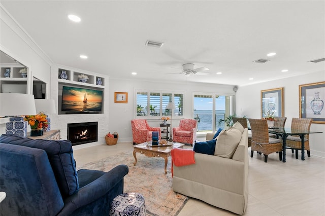433 S Paula Dr Unit 31, Dunedin, FL 34698 - living room with recessed lighting, a large fireplace, ceiling fan, and crown molding