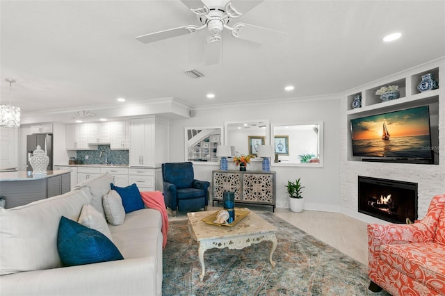 433 S Paula Dr Unit 31, Dunedin, FL 34698 - living area featuring ornamental molding, a fireplace, recessed lighting, ceiling fan, and wood finished floors