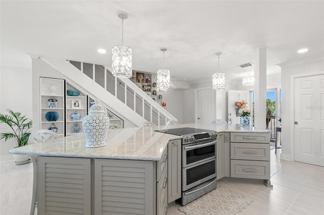 433 S Paula Dr Unit 31, Dunedin, FL 34698 - kitchen with gray cabinets, double oven range, a chandelier, ornamental molding, and light stone countertops