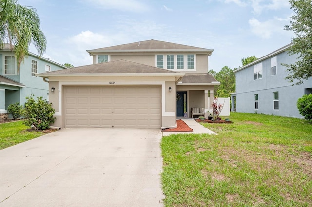 12624 White Bluff Rd, Hudson, FL 34669 - traditional-style home with stucco siding, a garage, a front yard, and concrete driveway