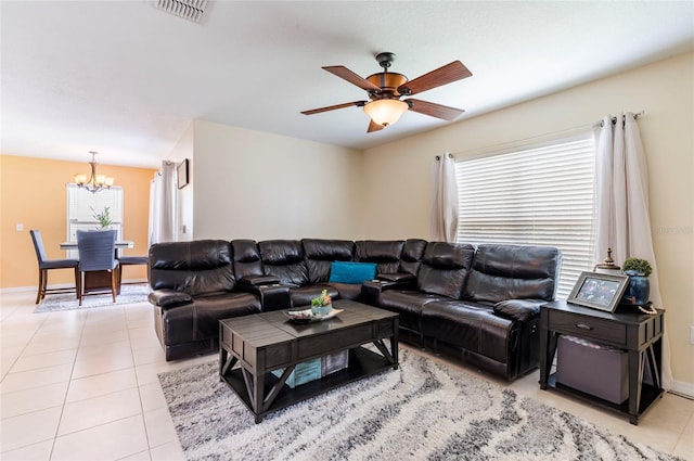 12624 White Bluff Rd, Hudson, FL 34669 - living room featuring a chandelier, light tile patterned floors, ceiling fan, and baseboards