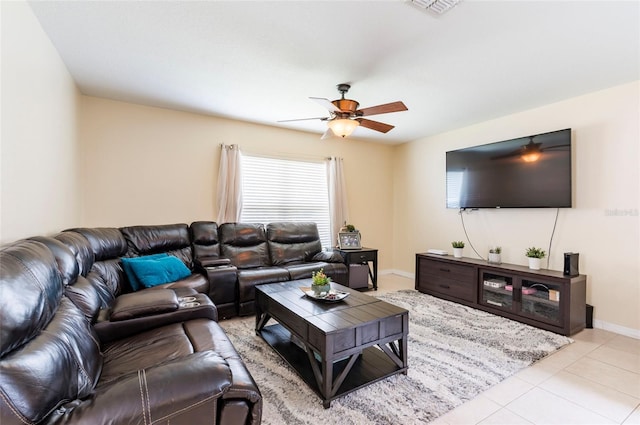 12624 White Bluff Rd, Hudson, FL 34669 - living room featuring ceiling fan, baseboards, and light tile patterned floors
