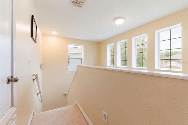12624 White Bluff Rd, Hudson, FL 34669 - hallway featuring an upstairs landing and baseboards