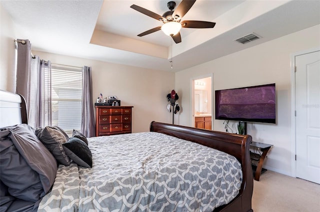 12624 White Bluff Rd, Hudson, FL 34669 - bedroom featuring carpet flooring, a tray ceiling, a ceiling fan, and baseboards