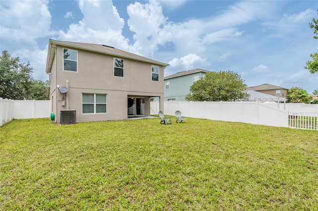 12624 White Bluff Rd, Hudson, FL 34669 - rear view of property with stucco siding, central AC unit, and a patio area