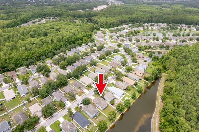 12624 White Bluff Rd, Hudson, FL 34669 - aerial view of property and surrounding area featuring a heavily wooded area, a nearby body of water, and nearby suburban area