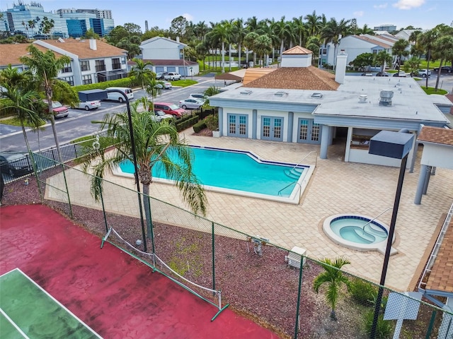 1967 Cormorant Ct Unit 515, Clearwater, FL 33762 - community pool featuring french doors, a hot tub, and a patio area