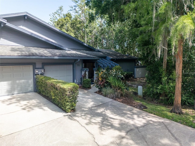 70 Morning Dove Pl, Oldsmar, FL 34677 - single story home featuring driveway, a shingled roof, and an attached garage