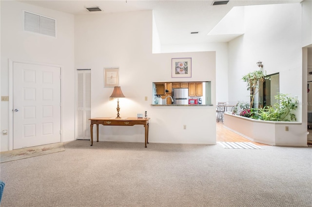 70 Morning Dove Pl, Oldsmar, FL 34677 - living area with light carpet and a high ceiling
