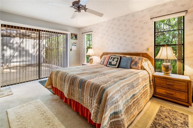 70 Morning Dove Pl, Oldsmar, FL 34677 - carpeted bedroom with access to outside, wallpapered walls, and ceiling fan