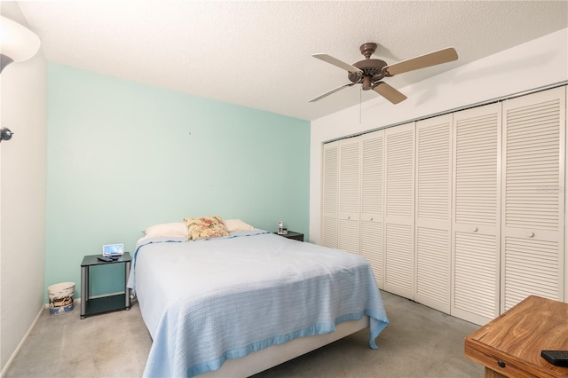 70 Morning Dove Pl, Oldsmar, FL 34677 - bedroom with carpet, a closet, ceiling fan, and a textured ceiling