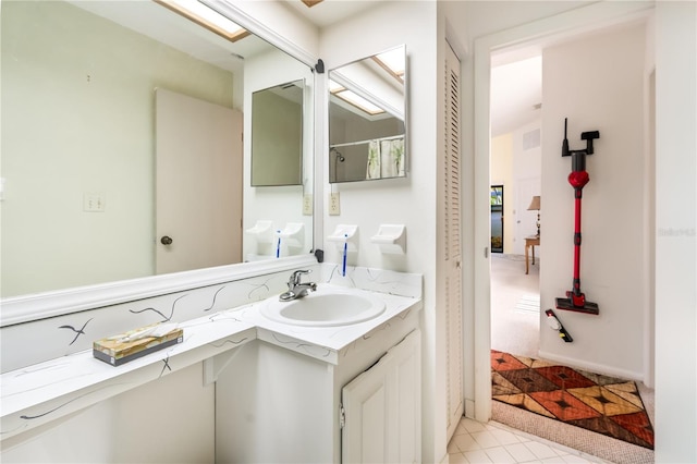 70 Morning Dove Pl, Oldsmar, FL 34677 - bathroom featuring vanity, tile patterned flooring, and curtained shower