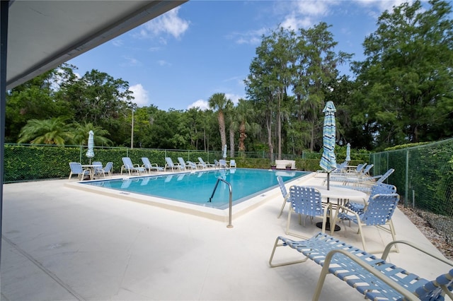 70 Morning Dove Pl, Oldsmar, FL 34677 - community pool featuring a patio and view of scattered trees