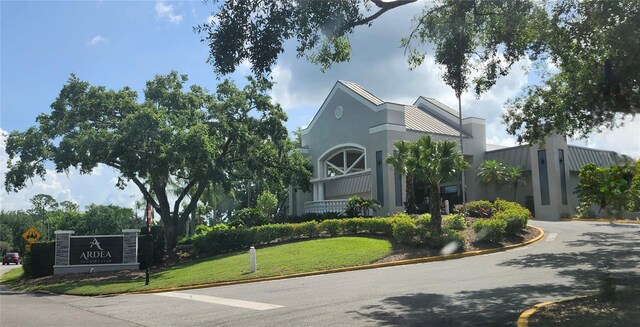 70 Morning Dove Pl, Oldsmar, FL 34677 - community / neighborhood sign featuring a lawn