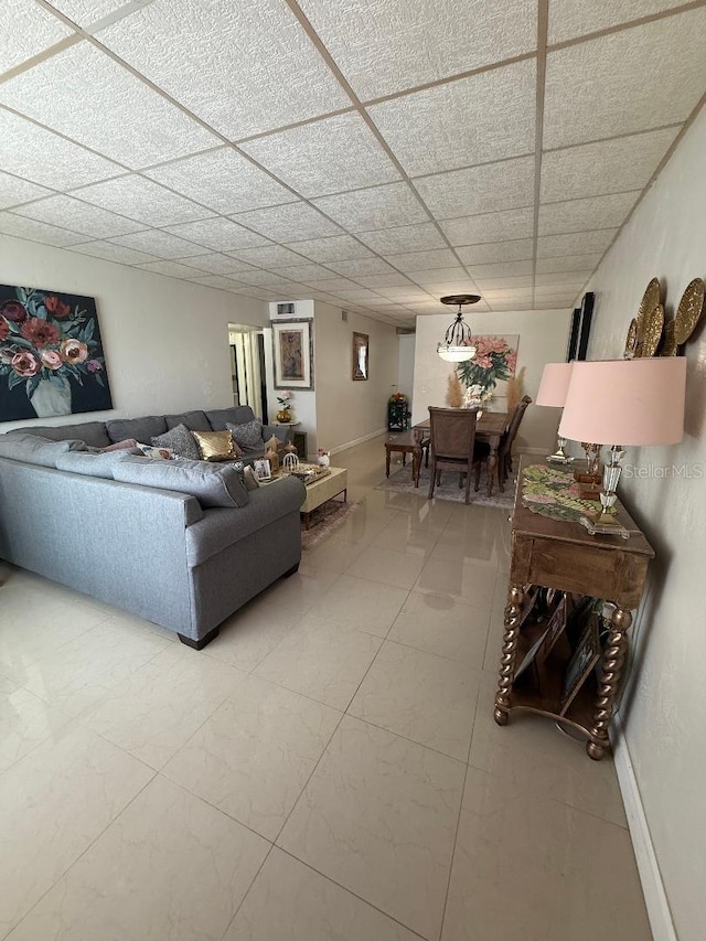 5860 43rd Ter N Unit 1518, Kenneth City, FL 33709 - living room with baseboards and a drop ceiling