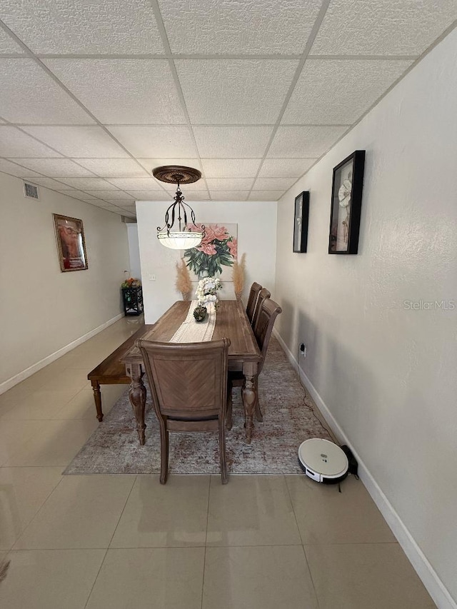 5860 43rd Ter N Unit 1518, Kenneth City, FL 33709 - tiled dining space featuring a drop ceiling and baseboards
