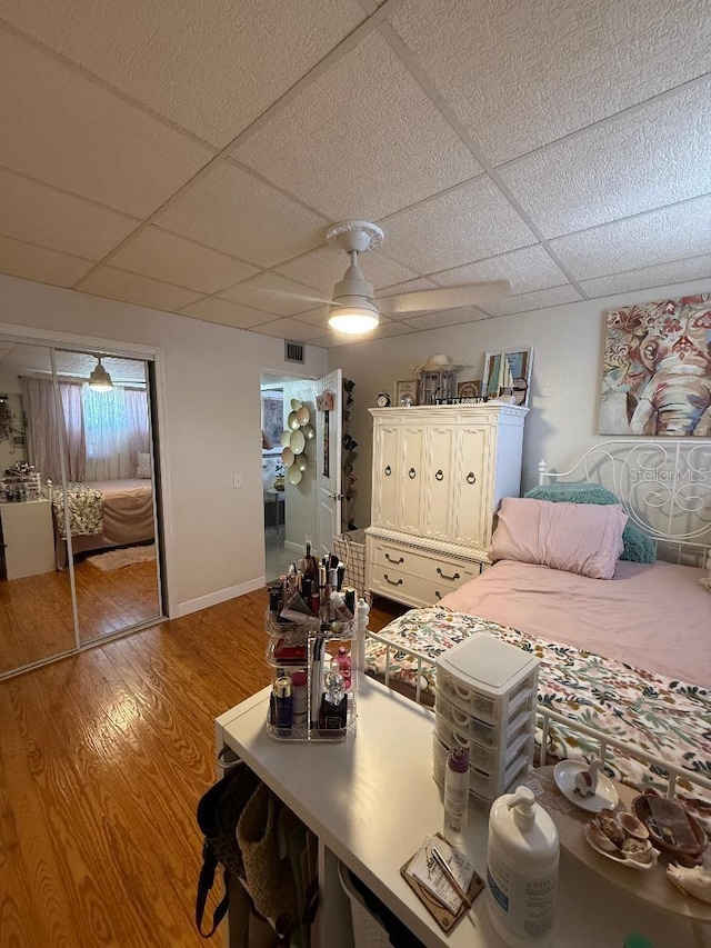5860 43rd Ter N Unit 1518, Kenneth City, FL 33709 - bedroom featuring a paneled ceiling, wood finished floors, and ceiling fan