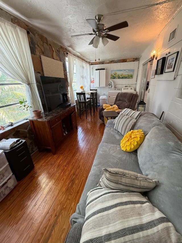 5860 43rd Ter N Unit 1518, Kenneth City, FL 33709 - living area featuring wood finished floors, a textured ceiling, and ceiling fan