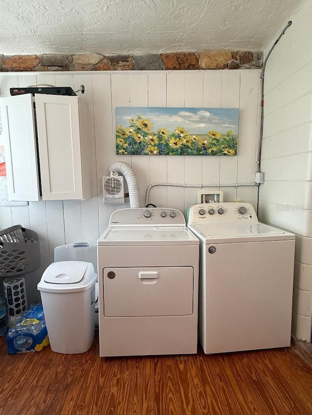 5860 43rd Ter N Unit 1518, Kenneth City, FL 33709 - washroom featuring washer and dryer, wood finished floors, and cabinet space