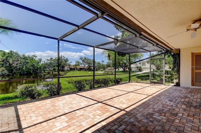50 Ingrid Pl Unit 50, Oldsmar, FL 34677 - unfurnished sunroom with a water view and ceiling fan
