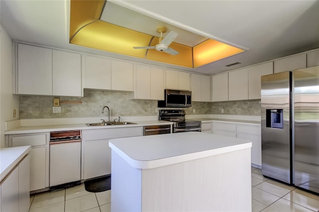 50 Ingrid Pl Unit 50, Oldsmar, FL 34677 - kitchen with appliances with stainless steel finishes, a sink, ceiling fan, and light tile patterned floors