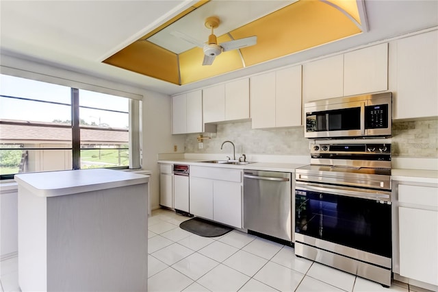 50 Ingrid Pl Unit 50, Oldsmar, FL 34677 - kitchen with stainless steel appliances, a sink, plenty of natural light, and light countertops