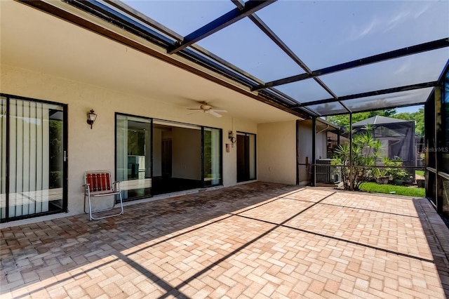 50 Ingrid Pl Unit 50, Oldsmar, FL 34677 - view of patio featuring ceiling fan, a lanai, and central AC unit