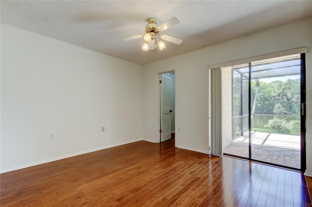 50 Ingrid Pl Unit 50, Oldsmar, FL 34677 - unfurnished room featuring wood finished floors, ceiling fan, baseboards, and a textured ceiling