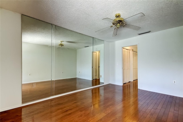 50 Ingrid Pl Unit 50, Oldsmar, FL 34677 - unfurnished room featuring a ceiling fan, wood finished floors, and a textured ceiling