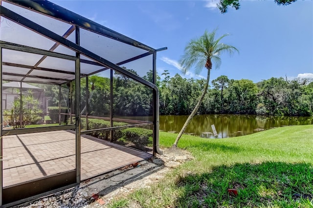50 Ingrid Pl Unit 50, Oldsmar, FL 34677 - view of grassy yard featuring a water view and a lanai