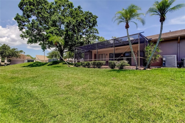 50 Ingrid Pl Unit 50, Oldsmar, FL 34677 - view of green lawn featuring central AC and a lanai