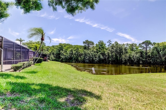 50 Ingrid Pl Unit 50, Oldsmar, FL 34677 - view of green lawn featuring a water view and glass enclosure
