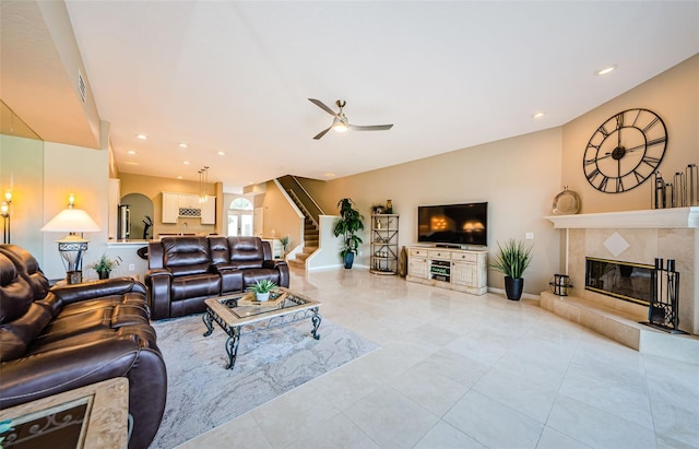1710 Lago Vista Blvd, Palm Harbor, FL 34685 - tiled living area featuring a fireplace, stairway, a ceiling fan, recessed lighting, and lofted ceiling