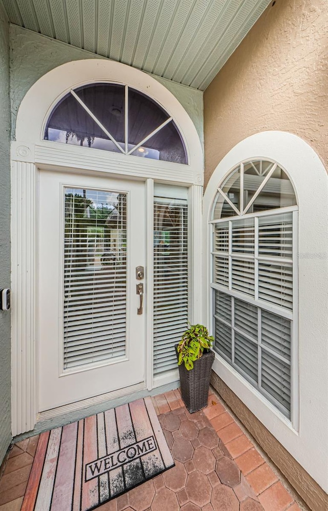 1710 Lago Vista Blvd, Palm Harbor, FL 34685 - view of exterior entry with stucco siding
