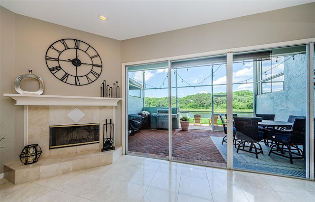 1710 Lago Vista Blvd, Palm Harbor, FL 34685 - living room featuring a sunroom, a fireplace, and recessed lighting