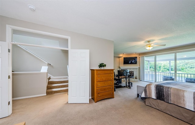 1710 Lago Vista Blvd, Palm Harbor, FL 34685 - bedroom featuring access to outside, light colored carpet, and a ceiling fan