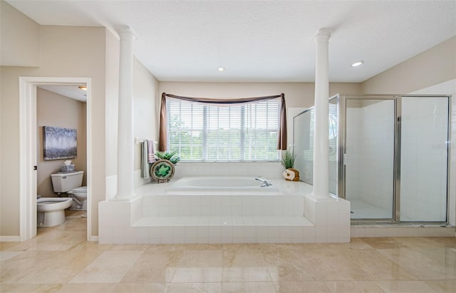 1710 Lago Vista Blvd, Palm Harbor, FL 34685 - bathroom featuring ornate columns, a bath, a bidet, a shower stall, and tile patterned flooring