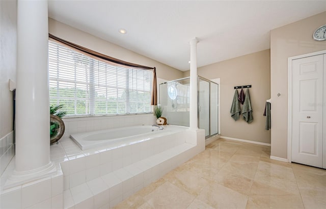 1710 Lago Vista Blvd, Palm Harbor, FL 34685 - full bath with a garden tub, a shower stall, and ornate columns