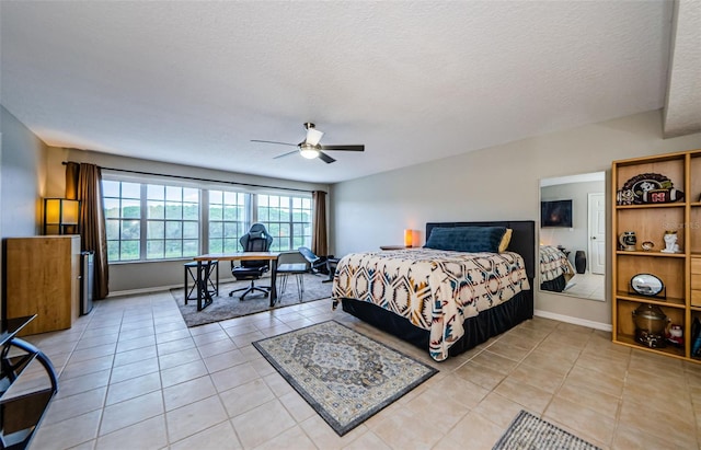 1710 Lago Vista Blvd, Palm Harbor, FL 34685 - bedroom with an office area, light tile patterned floors, a ceiling fan, and a textured ceiling