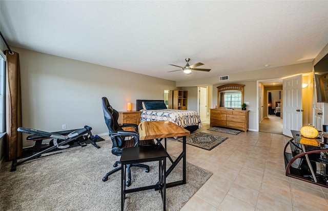 1710 Lago Vista Blvd, Palm Harbor, FL 34685 - bedroom with light tile patterned flooring, a textured ceiling, and ceiling fan