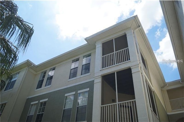 9320 Crescent Loop Cir Unit 304, Tampa, FL 33619 - view of home's exterior with stucco siding