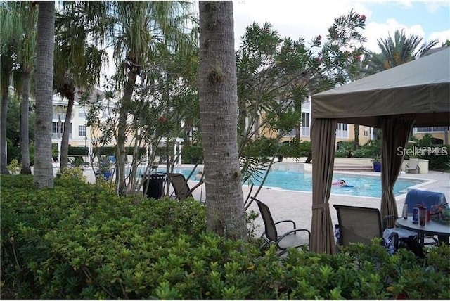 9320 Crescent Loop Cir Unit 304, Tampa, FL 33619 - community pool featuring a gazebo