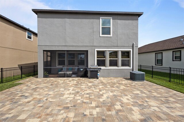 4077 Cadence Loop, Land O Lakes, FL 34638 - back of house with a patio, central AC unit, and stucco siding