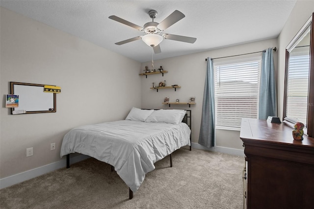 4077 Cadence Loop, Land O Lakes, FL 34638 - bedroom with light carpet, baseboards, and ceiling fan