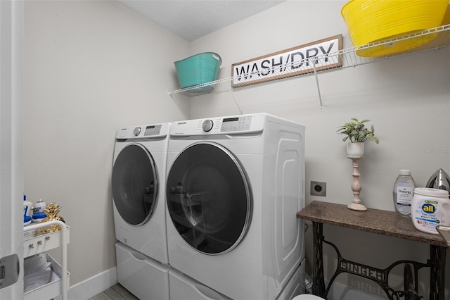 4077 Cadence Loop, Land O Lakes, FL 34638 - washroom featuring washing machine and clothes dryer